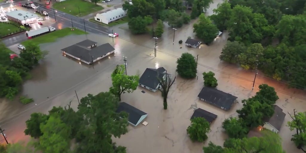 Drone video shows Texas town underwater as boats rescue residents trapped in homes